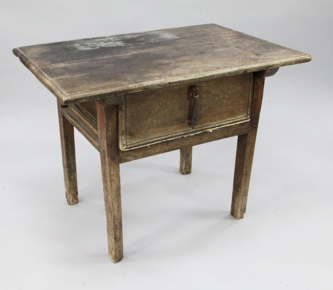An 18th century Spanish walnut side table, with deep single frieze drawer, on square section legs,