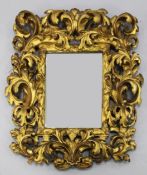 An 18th century Italian carved giltwood wall mirror, with pierced acanthus scroll frame and