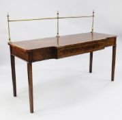 A mahogany breakfront serving table, with brass gallery back, single frieze drawer and bell flower