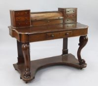 A Victorian mahogany dressing table, the superstructure now with trinket drawers and central roll