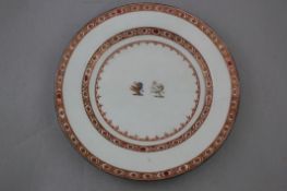 An English porcelain armorial plate and a French armorial breakfast cup, late 18th and late 19th