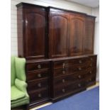 A 19th century mahogany and boxwood line inlaid breakfront bookcase, fitted four panelled doors