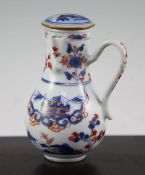 A Chinese Imari chocolate pot and cover, Kangxi period, of baluster form, painted with pavilions and