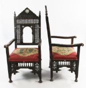 A late 19th century moorish open armchair, with Mashrabiya panels and mother of pearl inlaid