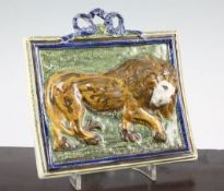 An unusual Pearlware pottery 'lion' plaque, c.1810, painted in Pratt-type colours with a standing