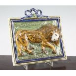 An unusual Pearlware pottery 'lion' plaque, c.1810, painted in Pratt-type colours with a standing