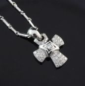 An Italian 18ct white gold and diamond set cruciform pendant by Chimento, on a similar 18ct white