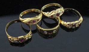 Five late Victorian/Edwardian 18ct gold, ruby and diamond set rings, various sizes.