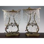 A pair of French gilt metal porcelain and crystal mounted niche lamps, early 20th century, the