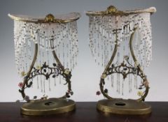 A pair of French gilt metal porcelain and crystal mounted niche lamps, early 20th century, the