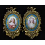 A pair of ormolu mounted Sevres style porcelain wall plaques, late 19th century, each painted with a