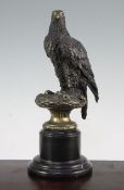 After Archibald Thorburn (1860-1935). A patinated bronze model of an eagle, the circular base signed