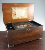 A 19th century Swiss rectangular music box, the lid with the remains of printed decoration,