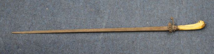 An 18th century German hangar or hunting sword, the ivory grip carved with lion head pommel, with