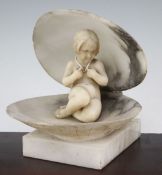 A late 19th century Italian carved alabaster model of a young girl, seated within a shell, on square