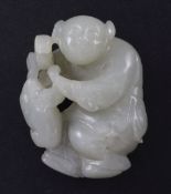 A Chinese pale celadon jade carving of Liu Hai and his three legged toad, 19th century, 4.4cm.