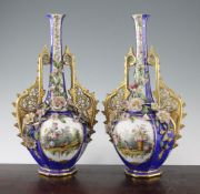 A pair of French jewelled and flower encrusted porcelain bottle vases A pair of Paris porcelain