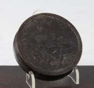 An early 19th century pressed horn circular snuff box, 3.25in. An early 19th century pressed horn