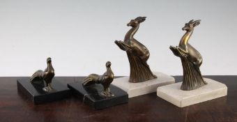 Two pairs of bookends A pair of 1930's French patinated metal bookends, modelled as leaping deer,