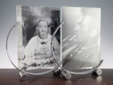A pair of stylish Art Deco crescent shaped photograph frames, both 16in. A pair of stylish Art