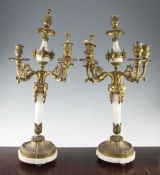 A pair of Louis XVI style white marble and ormolu mounted five branch candelabra, 30in. A pair of