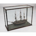 A model of an 18th century frigate, overall 40.5in. A model of an 18th century frigate, within a