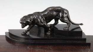 An Art Deco bronzed metal figure of a panther, 16.5in. An Art Deco bronzed metal figure of a