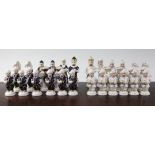 A 20th century Royal Dux porcelain figural chess set, A 20th century Royal Dux porcelain figural