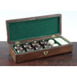 A mahogany cased set of indoor carpet bowls, 9.75in. A mahogany cased set of indoor carpet bowls,