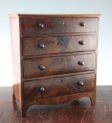 A 19th century mahogany miniature chest, 12.5in. A 19th century mahogany miniature chest, of four