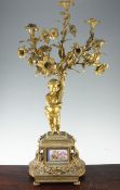 A 19th century French figural candelabrum, 36in. A 19th century French figural candelabrum, with