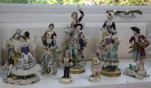 A group of eleven Continental porcelain figures and groups, late 19th / 20th century, 11cm - 27cm