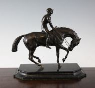 A 20th century bronze figure of a jockey and horse, 12in. A 20th century bronze figure of a jockey