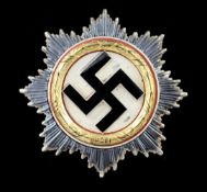 A Third Reich German cross, A Third Reich German cross, in gold with enamelled black Swastika