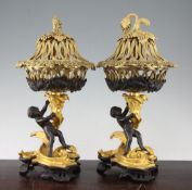 A pair of Regency style ormolu and patinated bronze pot pourri, 15in. A pair of Regency style ormolu