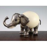 Gabriella Binazzi, Italian. An ostrich egg model elephant, with silver plated mounts and ivory