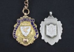 An Edwardian 15ct gold and enamel Everton Football Club medallion, with 9ct gold T bar and