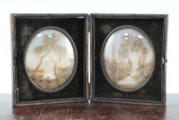 A pair of 19th century French oval memorial hair work pictures, both depicting graves beneath a