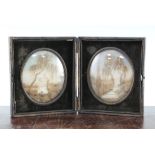 A pair of 19th century French oval memorial hair work pictures, both depicting graves beneath a