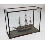 A model of an 18th century frigate, within a mahogany glazed display case, overall 40.5in.