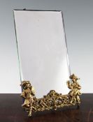 A rectangular French bevelled glass easel mirror, with gilt metal mounts depicting male and female