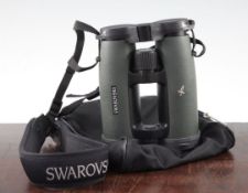 A pair of Swarovski EL 10 x 42 Swarovision binoculars, with green rubber body, original canvas