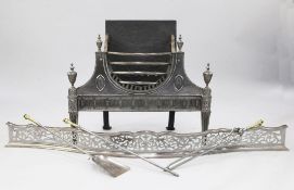A 19th century George III style steel fire grate, with blind fluted apron and square tapering husk