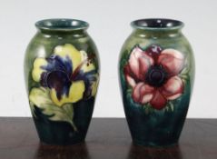 Two Moorcroft small ovoid vases, 1950's, the first decorated with anemone, the second with tiger