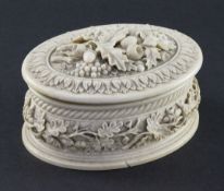 A 19th century oval carved ivory table box, the shaped body and lid relief carved with oak leaves