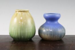 Two Ruskin pottery vases, the first of squat double gourd form decorated with a blue, green and