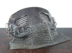 A WWI leather and chainmail tank mask, with slotted metal eye protectors, 7in.