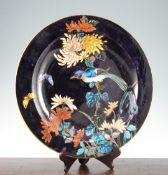 A Theodore Deck (1823-91) faience charger, post 1874, painted in imitation of cloisonne enamel