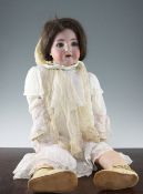 A large Simon Halbig bisque headed doll, with open mouth and teeth, with jointed composite body,