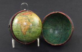 A Lane's Pocket Globe, London 1809, 2.75in. wide, the terrestrial globe within a black fishskin case